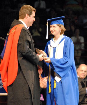 Gonzaga President Thayne McCulloh congratulates graduate/Tracy Simmons - SpokaneFAVS.com 