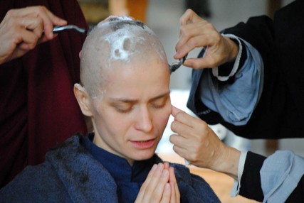 Daniela Mieritz head is shaved during an ordination ceremony. 