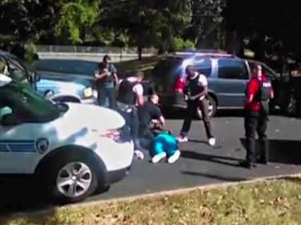 Keith Scott lies on the ground after being fatally shot by police in Charlotte, North Carolina, U.S. in this still image taken from video, received by Reuters, September 23, 2016. Courtesy of the Scott family/Handout via Reuters